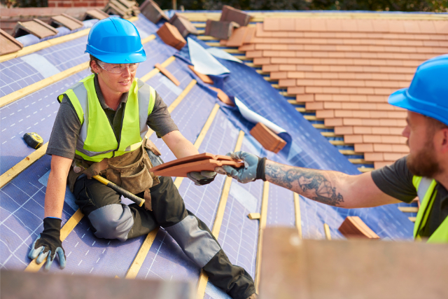 Vallejo new roof project by 2 workers with clay tiles.